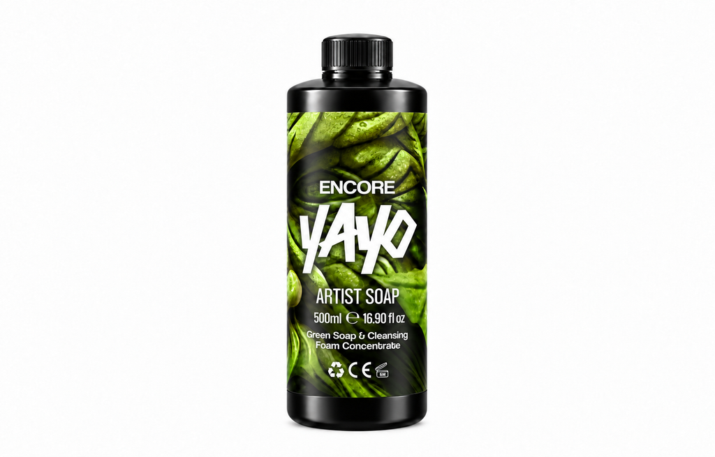 A 500ml black plastic bottle of Encore Yayo Artist Soap, featuring a green leaf-patterned label with bold white text, set against a plain white background.