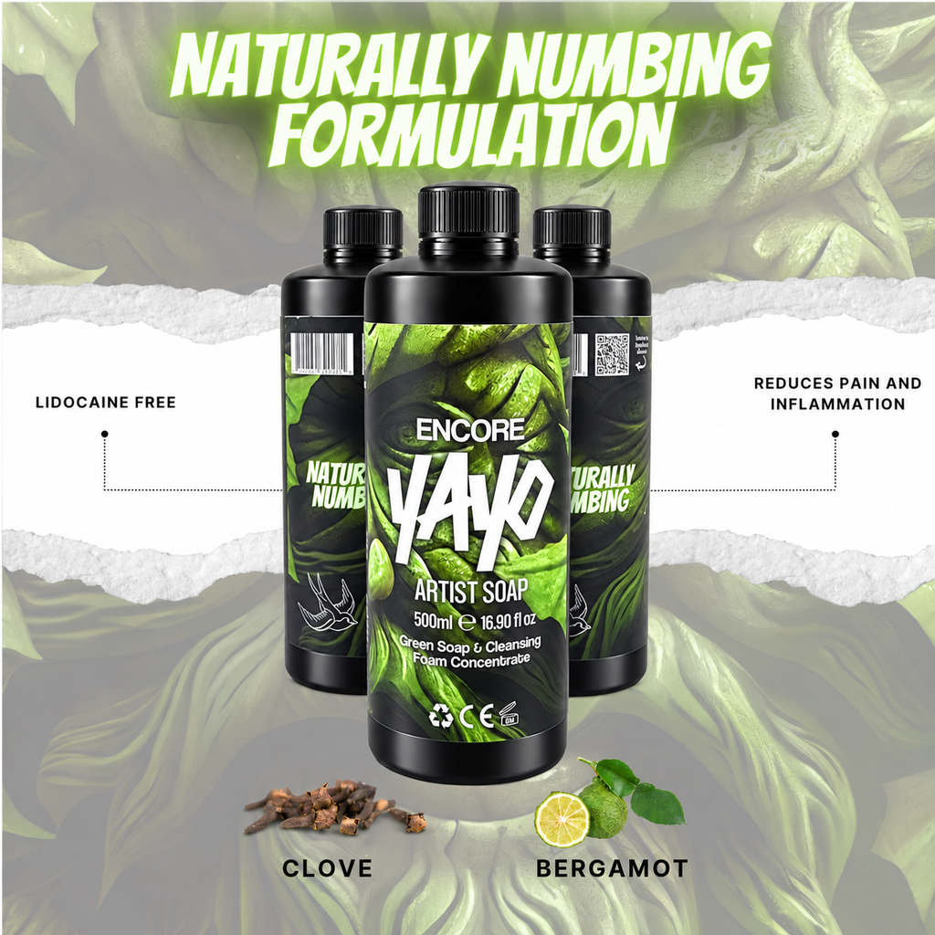Three black bottles of Encore YAYO Artist Soap centered on a green leafy background with text reading 'Naturally Numbing Formulation,' plus callouts for lidocaine free and pain/reduction benefits, plus clove and bergamot ingredient illustrations below.
